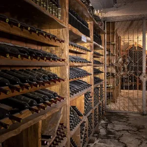 cellar aisle of racked bottles