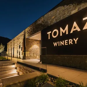 lit stone winery facade at dusk